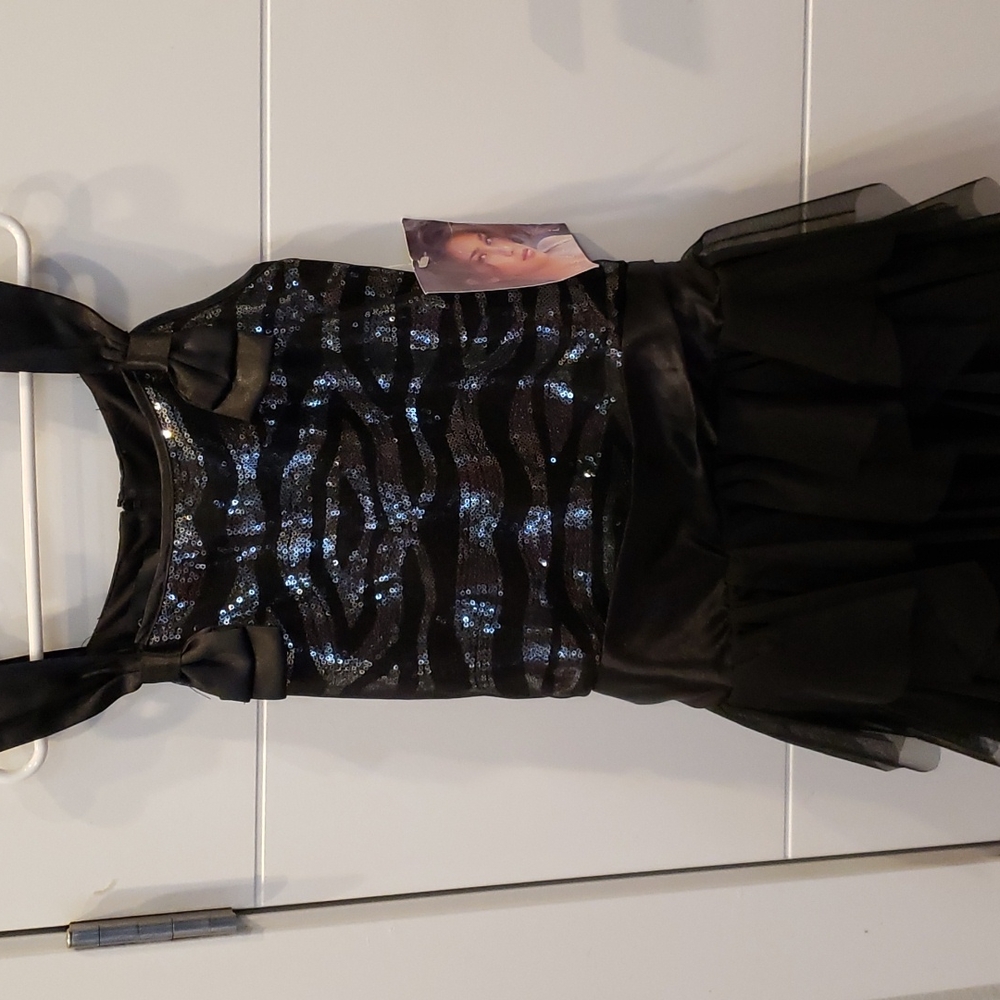 Brand: Biscotti Size:10 Color: Black (Never worn)